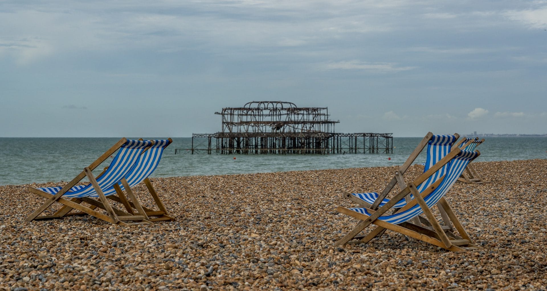 Pebbles and beach chairs after parking at brighton beach.