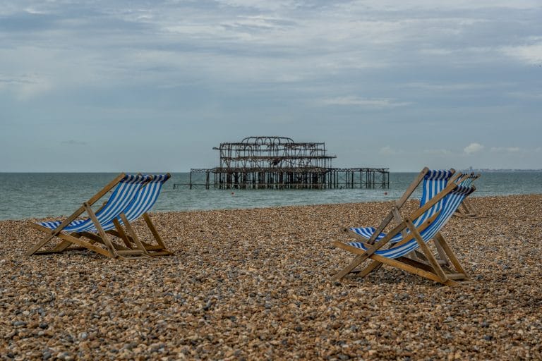 Pebbles and beach chairs after parking at brighton beach.