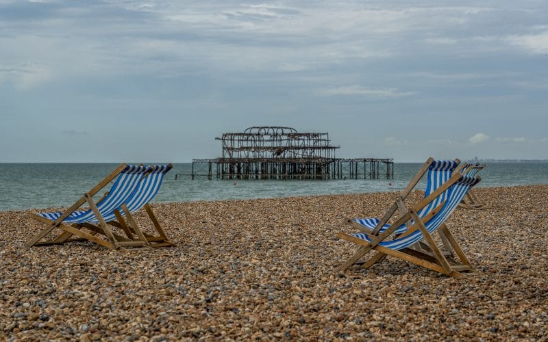 Pebbles and beach chairs after parking at brighton beach.