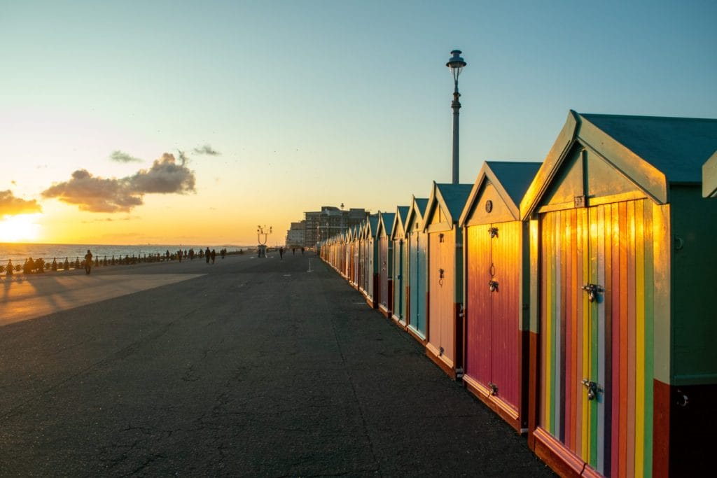 Brighton beach huts at sunset.