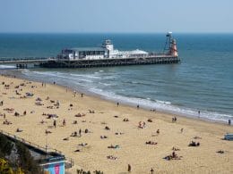 Bournemouth pier and beach on a sunny day.