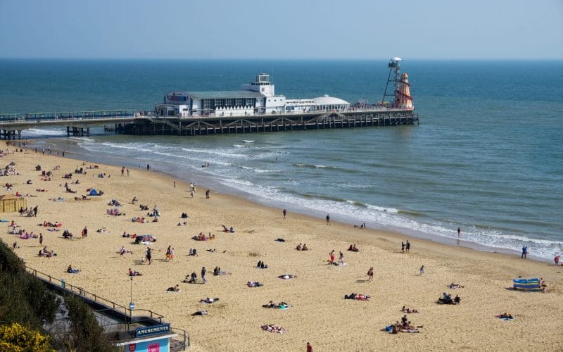 Bournemouth pier and beach on a sunny day.