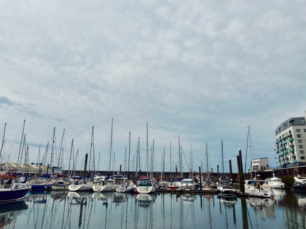 Boats docked at brighton marina.